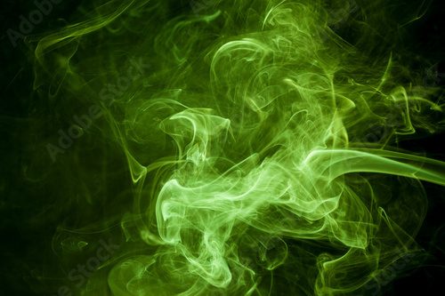 Fototapeta Green smoke on a black background. smoke on a black background.