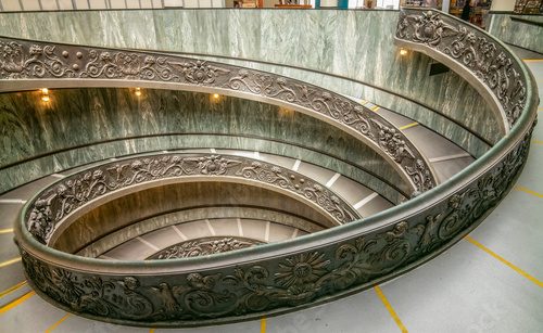 Fototapeta The stair in marble and bronze inside the Vatican Museums